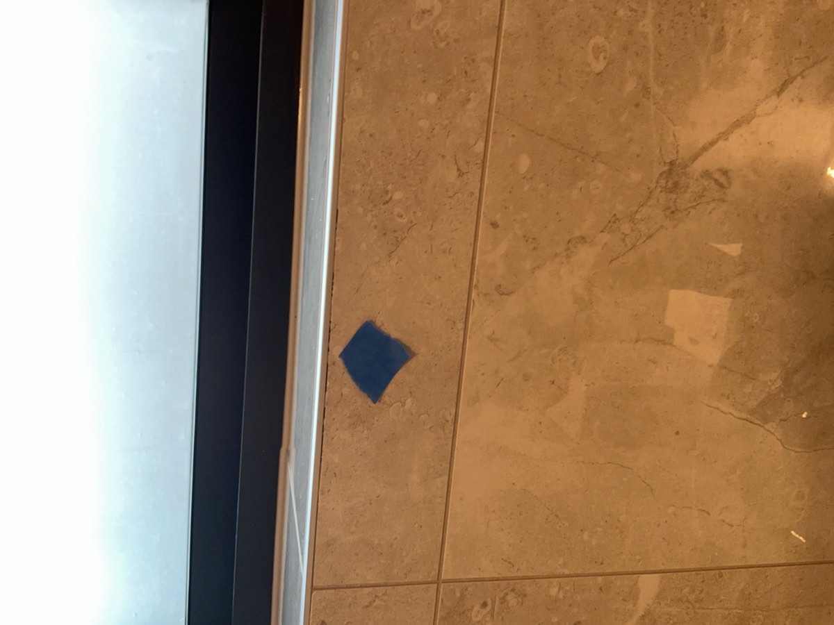 Grouting and joints defective, recorded during a handover inspection in Austral
