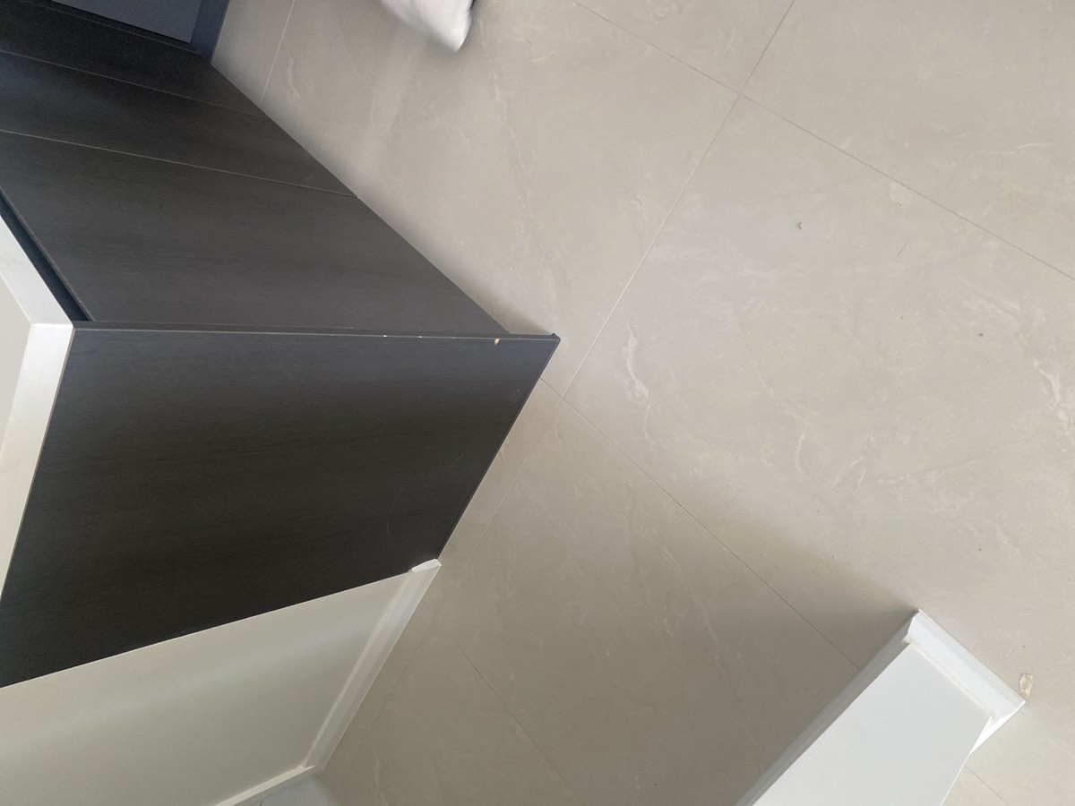 Cabinetry scratched or damaged, recorded during a handover inspection in Austral